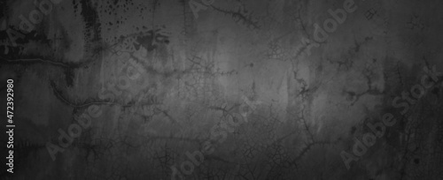 Panorama texture of dark gray concrete wall, Texture of a grungy black concrete wall as background. © Nisathon Studio