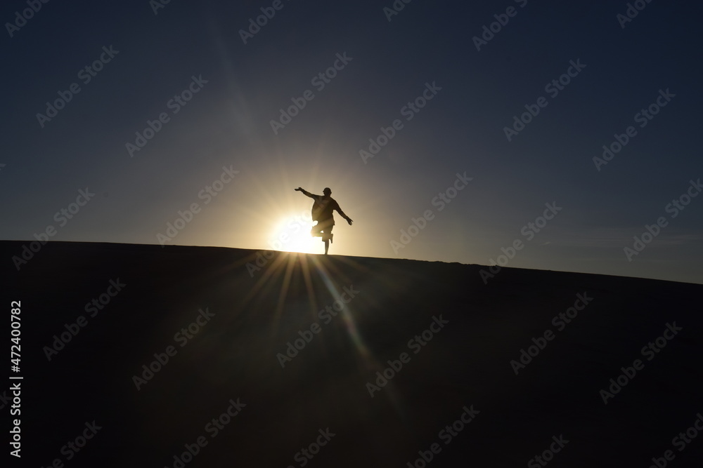 silhouette sunset over dune