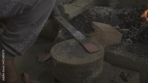 blacksmith working in the workshop photo