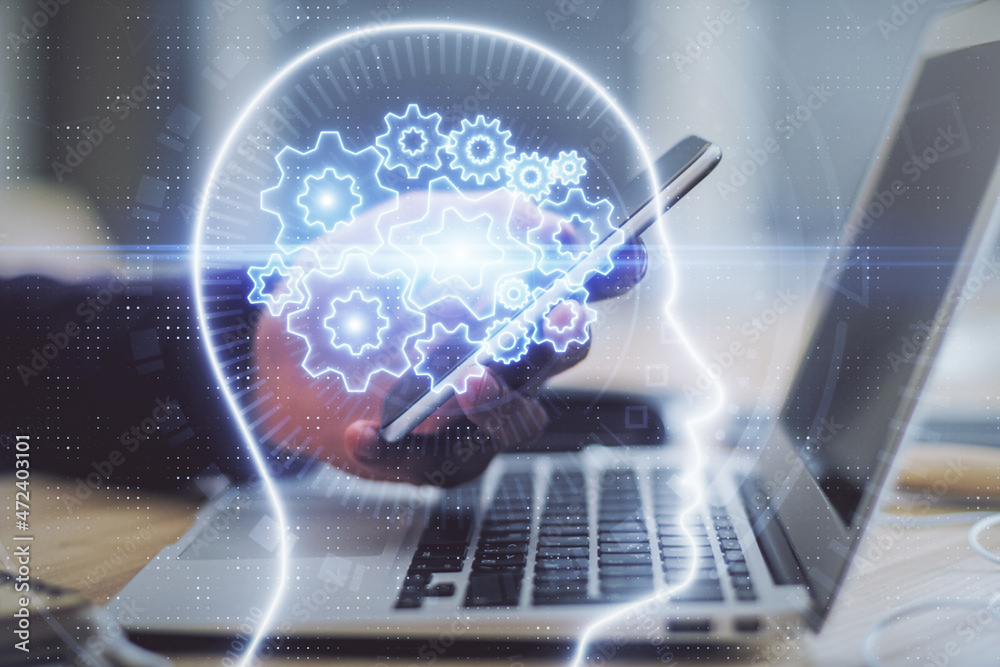 Double exposure of man's hand holding and using a digital device and brain hologram drawing. Data concept. Double exposure of man's hand holding and using a digital device and brain hologram drawing. Data concept.