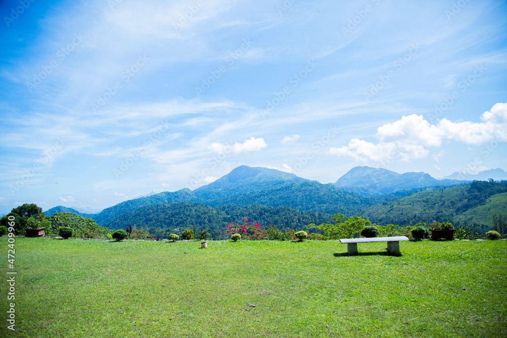 mountain landscape view from a garden with chairs