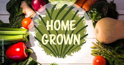 Home grown symbol text on fresh vegetables arranged on table
