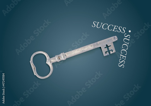 Key to success with chalk arrow on blackboard © kaptn