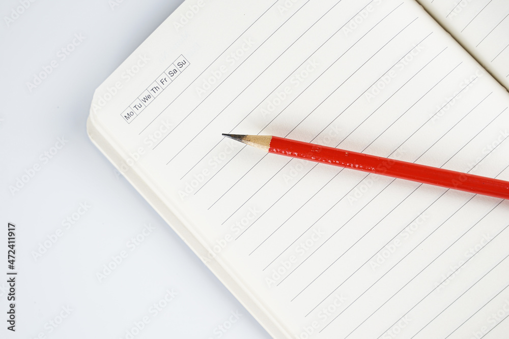 opened notebook and pencil on high angle shot. opened notebook and pencil on high angle shot.