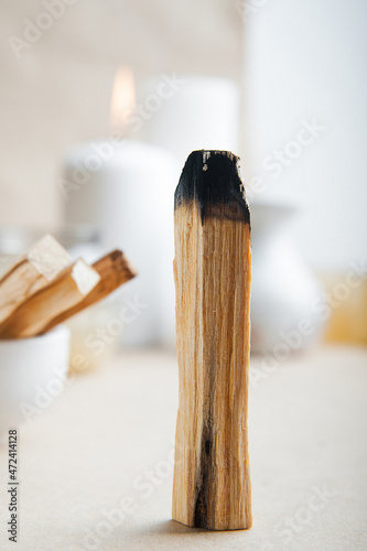 Selective focus. Palo Santo bars close-up and copy space. Ritual cleansing with sacred ibiocai, meditation, aromatherapy with incense and candles..