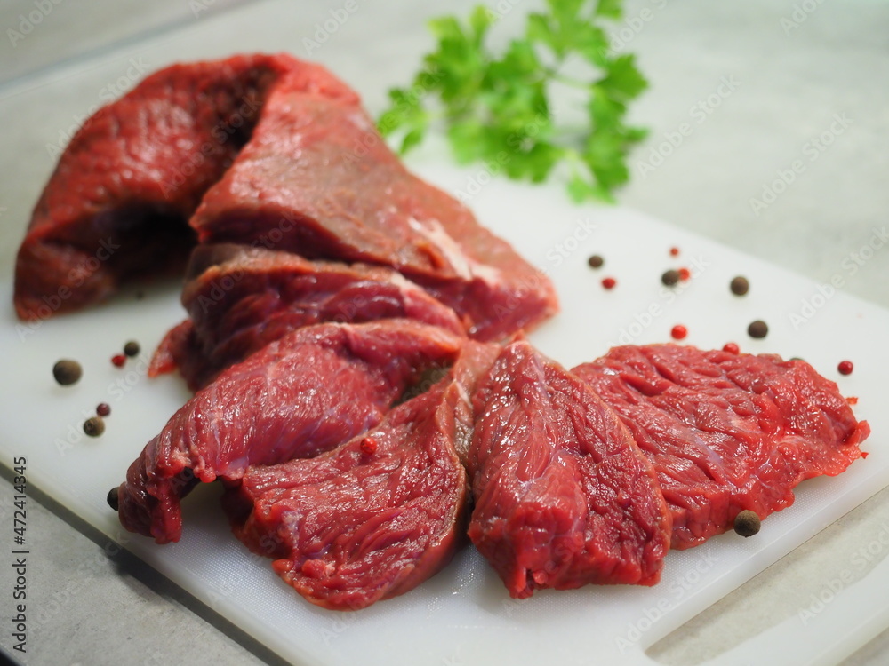 Boneless lamb steak meat with spices isolated on white Chopped beef, slices, abolition of vegetarianism, semi-finished meat products, soy meat Boneless lamb steak meat with spices isolated on white Chopped beef, slices, abolition of vegetarianism, semi-finished meat products, soy meat