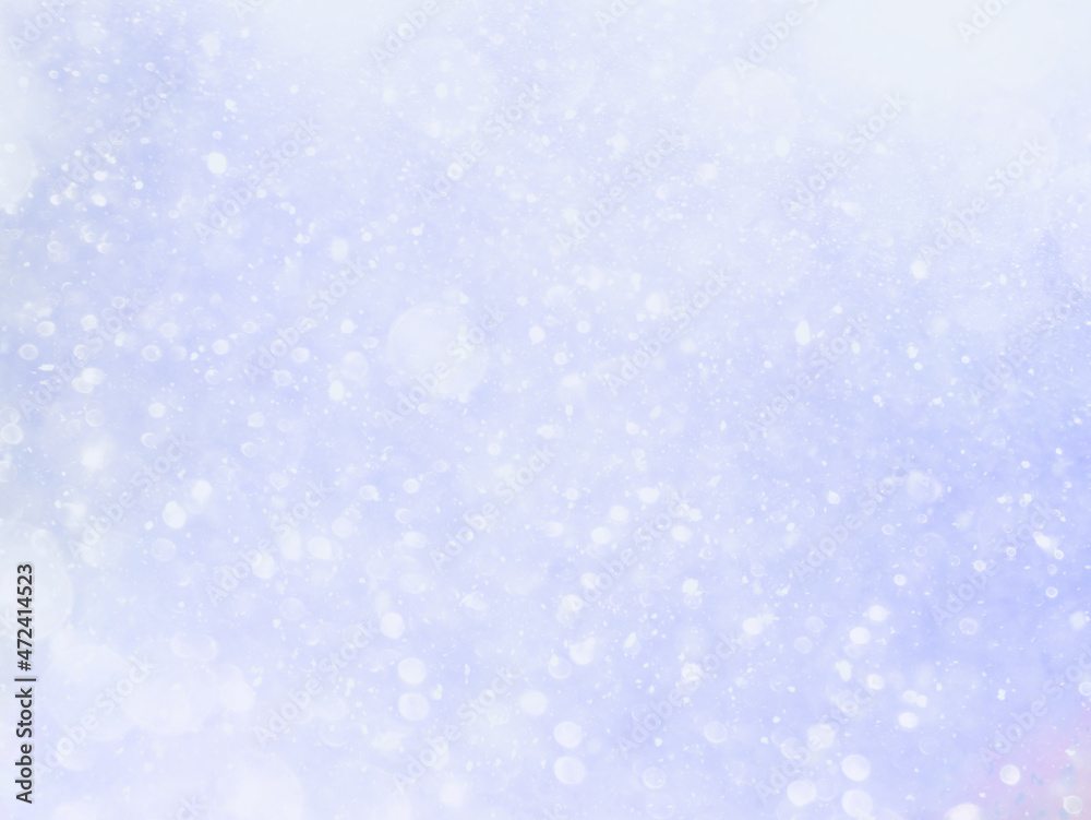 Abstract background with bokeh effect. White snow on blue sky. Winter pattern best for Christmas design. 