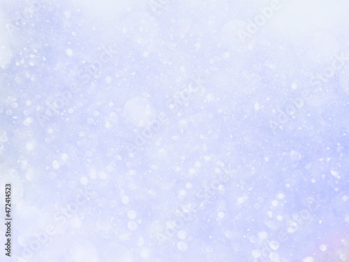 Abstract background with bokeh effect. White snow on blue sky. Winter pattern best for Christmas design. 