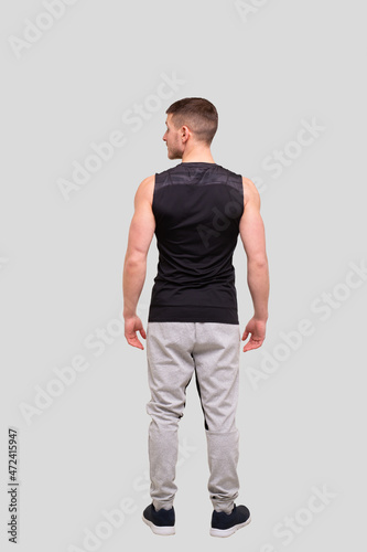Man Standing Turned Back to Camera Full Lenght. Sport man Isolated
