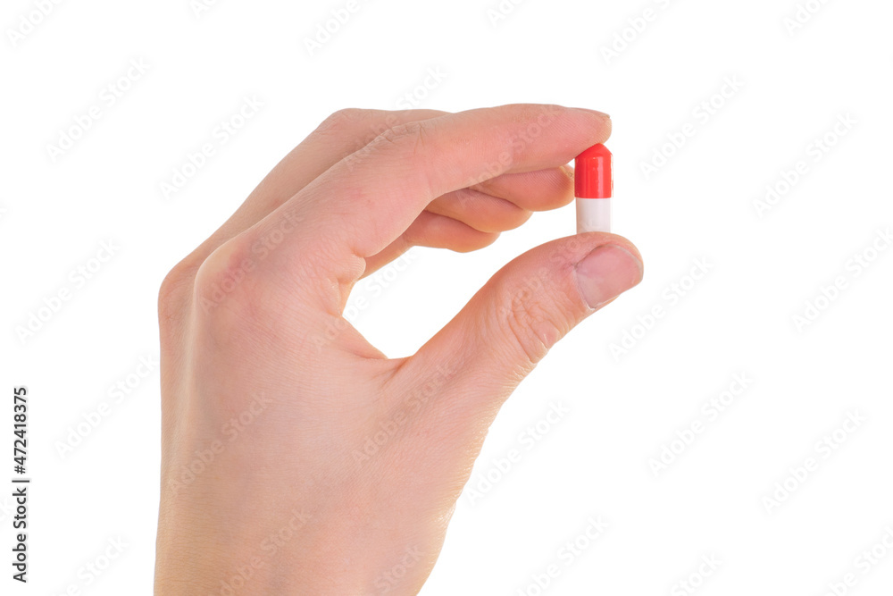 tablet capsule is held in the hand with your fingers