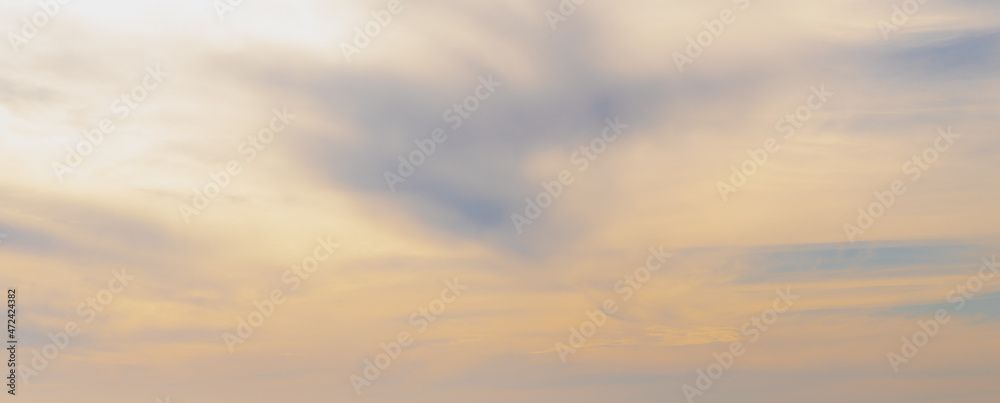 Panorama sunset with blue and golden yellow sky, Beautiful orange sky during the sun going down in evening, Horizon nature background.