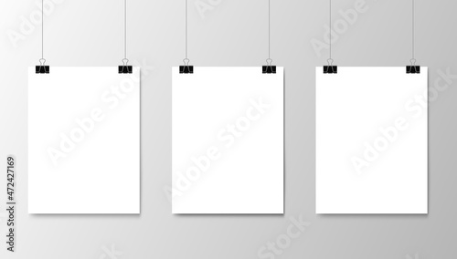 Hanging white paper posters mockup. Realistic sheets of paper on strings. Gallery exhibition, business presentation or shop showcase 3d vector blank posters, frames hanging on black binder paper clips