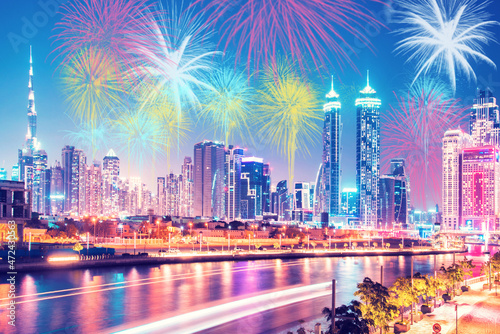 Beautiful bright colorful city landscape in Dubai, OAE and the sky in festive New Year's fireworks