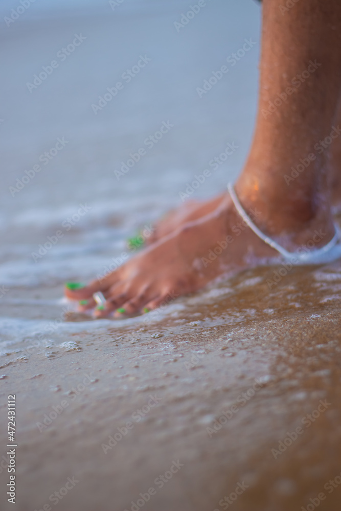 Indian married women wears Anklet, toe ring and standing towards sea