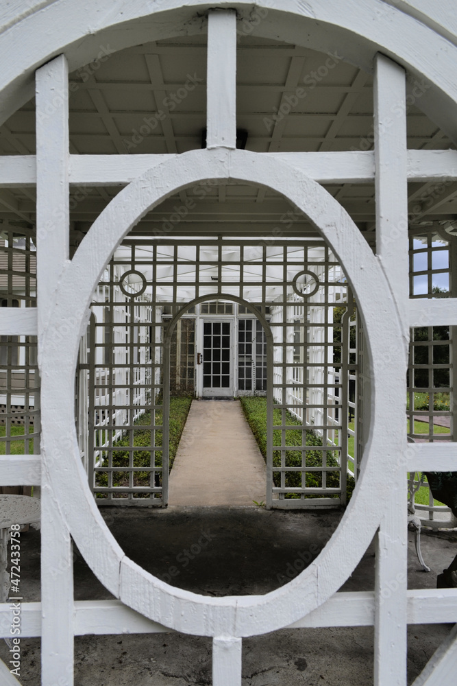 Zoom of the doors to the white wooden patio in the garden
