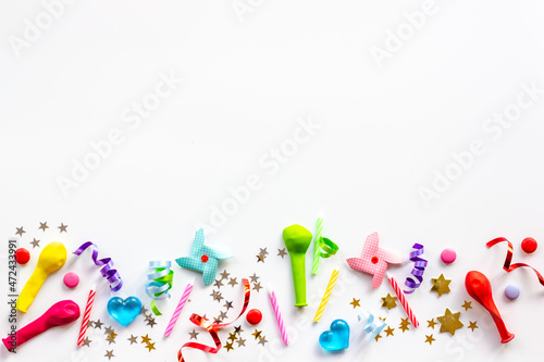 Children kids party flat lay confetti with party hats and balloons