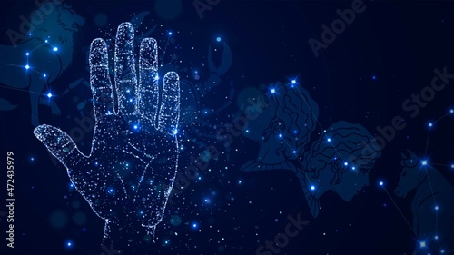 Hand made of blue sparks against the background of the starry sky with the constellations of the zodiac