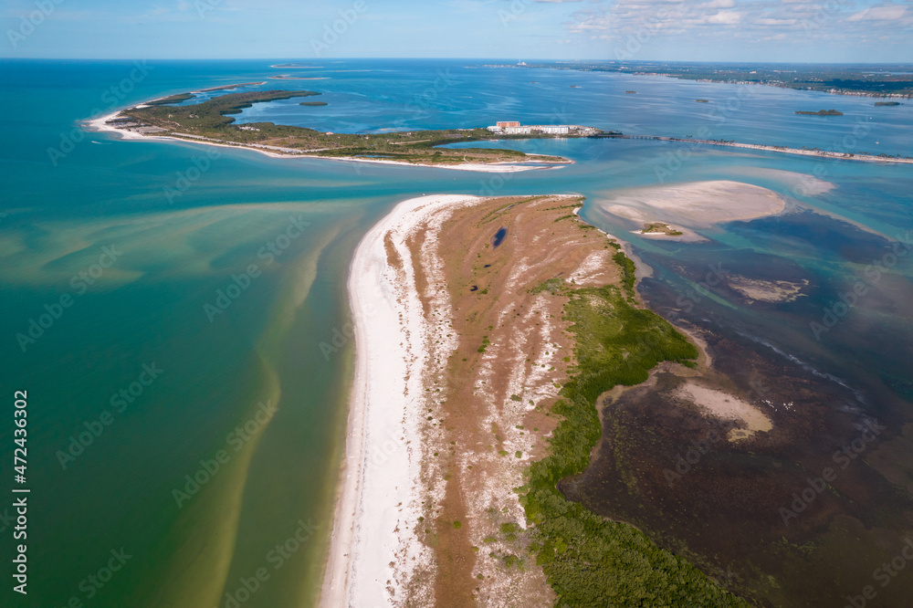 Island. Florida beach. Panorama of Honeymoon Island State Park and Caladesi Island. Blue-turquoise color of salt water. Ocean or Gulf of Mexico. Summer vacations in USA. Tropical Nature. Aerial view