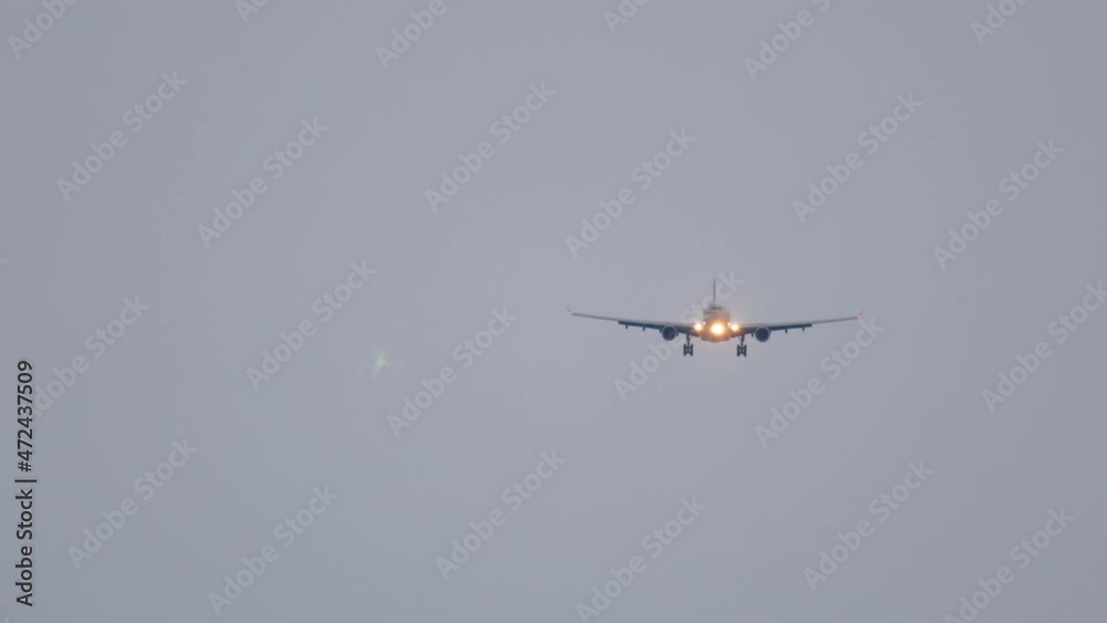 Airliner landing in the dusk Airliner landing in the dusk