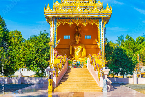 Golden Buddha Wat Phadung Tham Phothi temple Khao Lak Thailand. photo