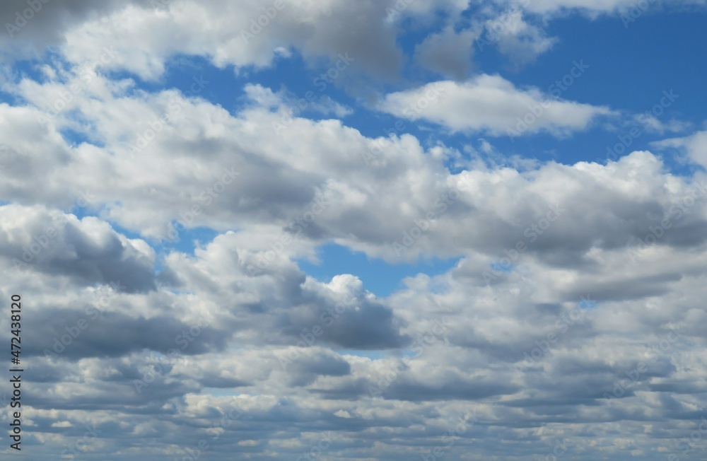 Blue sky with beautiful white cumulus clouds, natural background
