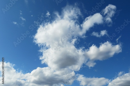 Beautiful fluffy clouds in the blue sky, natural background 