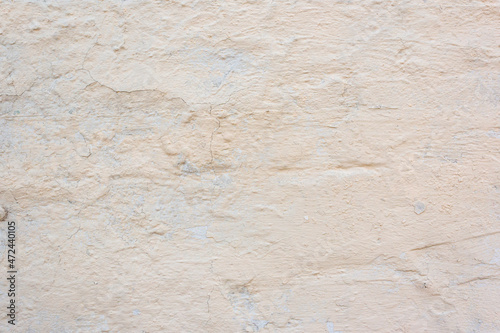 Imperfect gypsum plaster surface. Old cracked wall. Grunge wall texture for design. Old paint texture is chipping and cracked fall destruction.