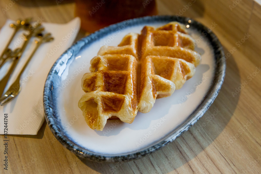 Plain Waffle on wooden background. Traditional Food. Plain Waffle on wooden background. Traditional Food.