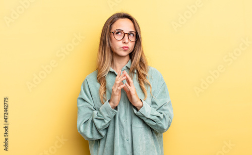 Konstfotografi pretty caucasian woman scheming and conspiring, thinking devious tricks and chea