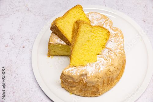 Homemade Savoie cake on a pretty white porcelain dish