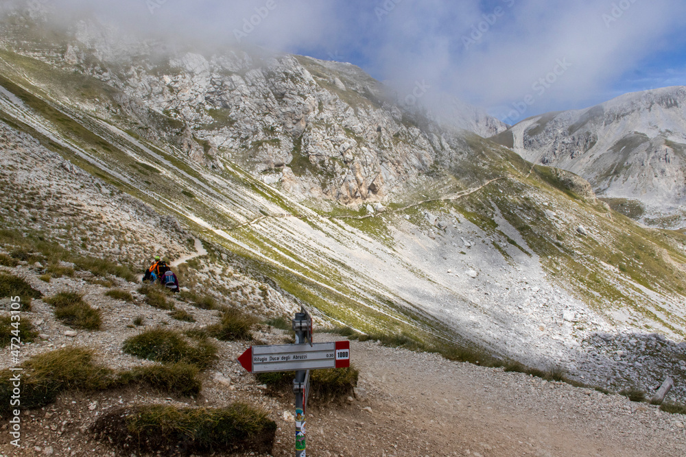 Corno Grande (2,912 m asl) is the highest peak of the mountain massif of the Gran Sasso of Italy and of the continental Apennines, located in the Abruzzo Apennines Corno Grande (2,912 m asl) is the highest peak of the mountain massif of the Gran Sasso of Italy and of the continental Apennines, located in the Abruzzo Apennines