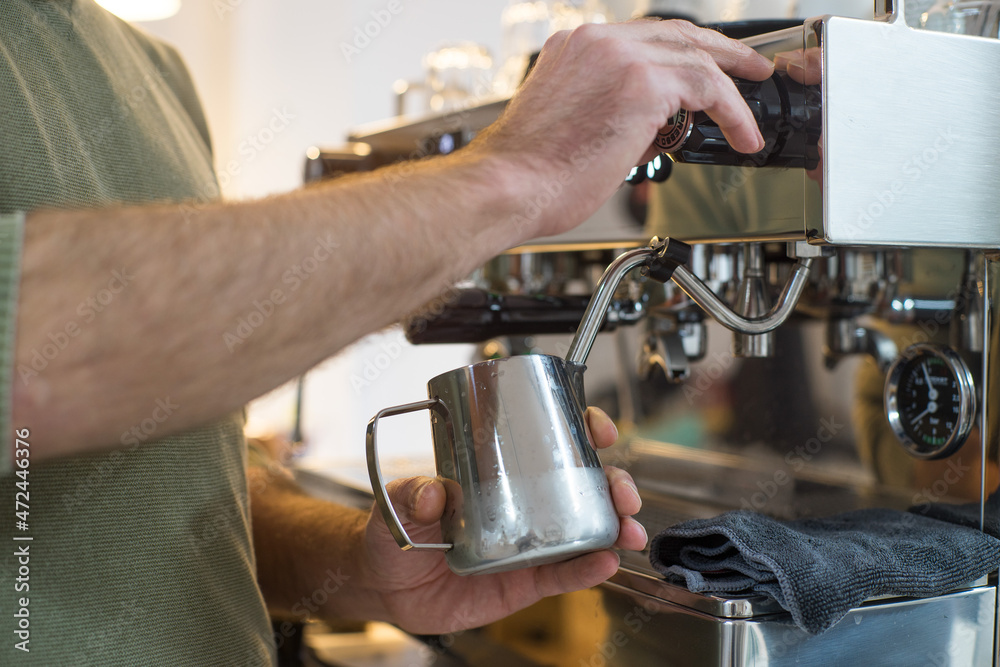 Bartender preparing a coffee in the bar