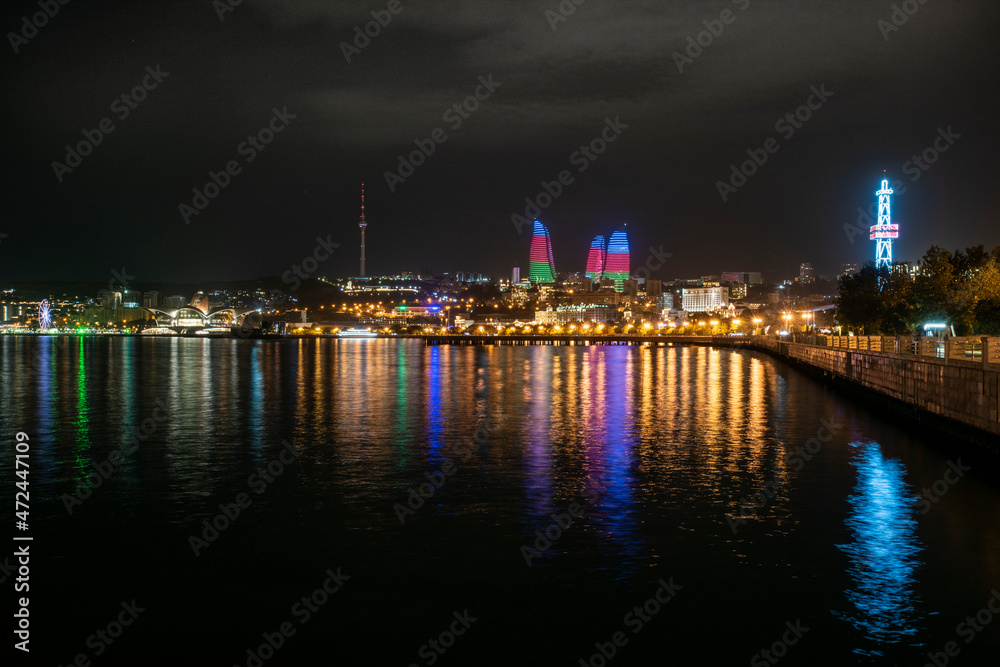 night photo of the waterfront of Baku, Azerbaijan, with the famous flame towers