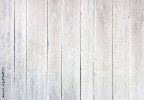 Old grey and White wooden background with cracks and scratches in vintage style