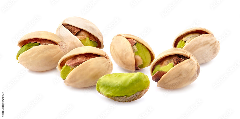 Pistachio nuts in closeup isolated on white background. Pistachio nuts in closeup isolated on white background.