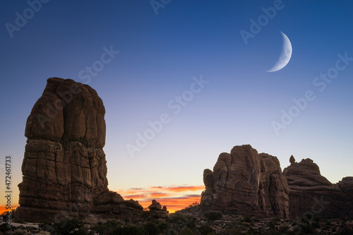 balanced rock in arches national park with sunset 