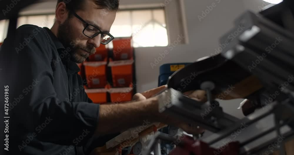 Luthier sands guitar frets at musical instruments repair shop, 4k 60fps 10 bit Luthier sands guitar frets at musical instruments repair shop, 4k 60fps 10 bit