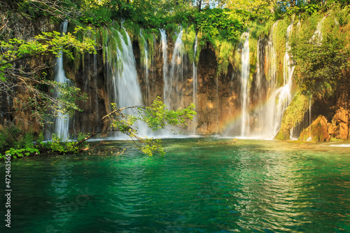 Lake and waterfall. Beautiful scenic view on a nature landscape.