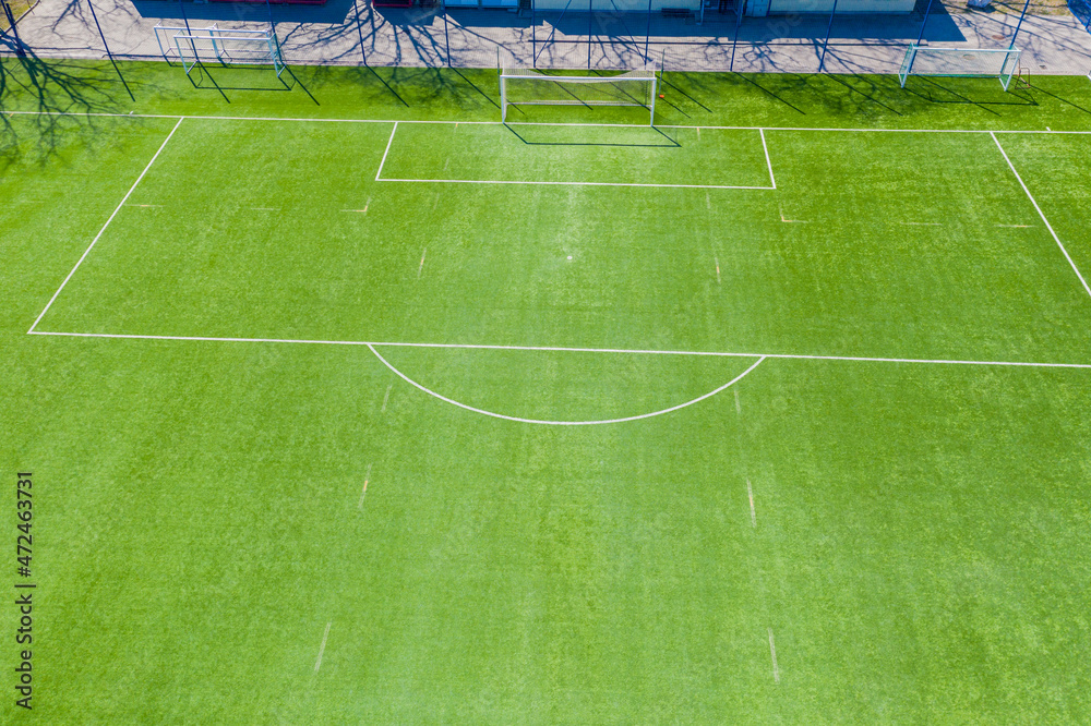 Obraz premium Aerial view of Sport concept of synthetic football or soccer fie