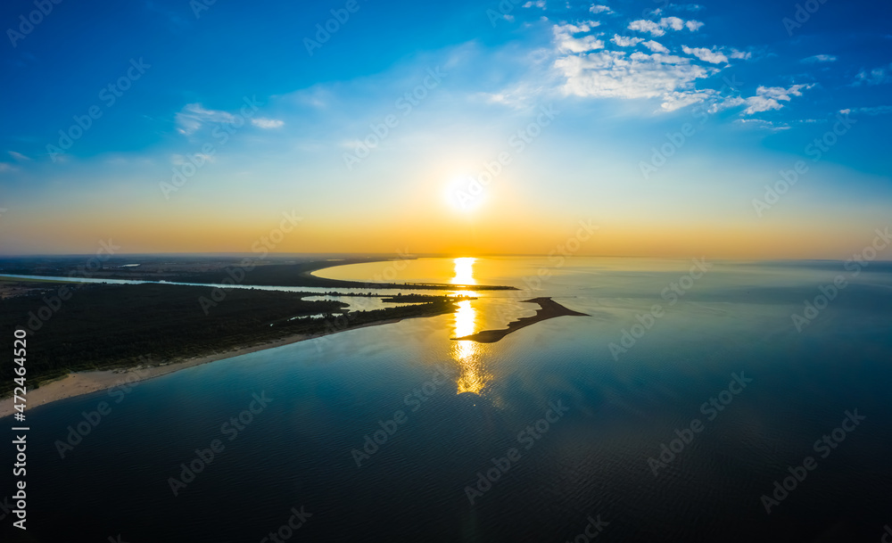 Minimalist aerial seascape - sunset over calm water