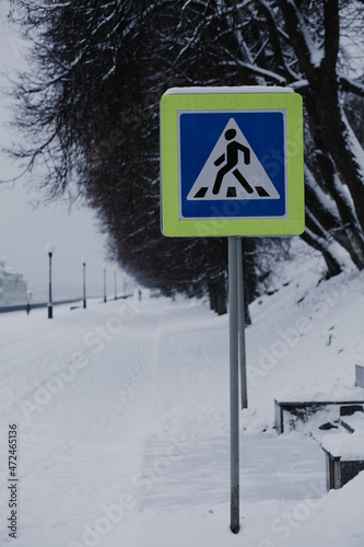 Road signs in winter by the road.