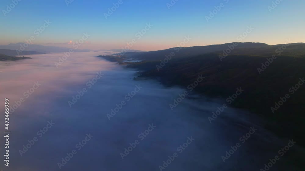 4K Scenic flight over beautiful mountain scape with bright sky and fog clouds on summer sunrise. Flight above clouds
4K Scenic flight over beautiful mountain scape with bright sky and fog clouds on summer sunrise. Flight above clouds