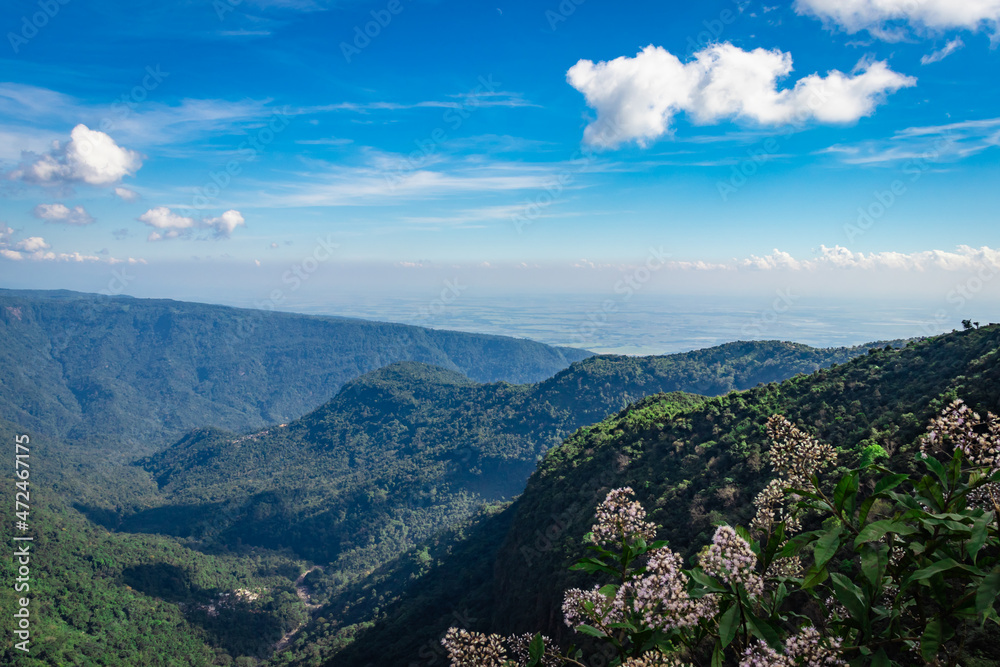 Obraz premium mountain range with bright blue sky at afternoon from flat angle