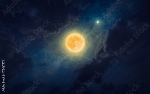 Amazing mysterious image – rising full moon in dark blue starry sky. Full moon party concept image.