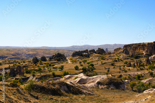 Scenic aerial landscape view of geologic formations of Cappadocia. Amazing shaped sandstone rocks. Famous touristic place and romantic travel destination. Picturesque autumn view