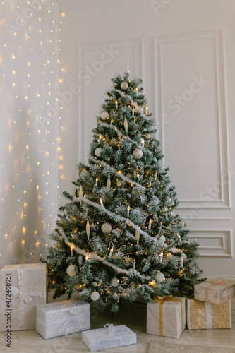 Minimalist Christmas interior with gifts under the Christmas tree