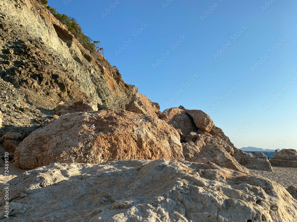 sand stone,large sandy rock in autumn at sunset