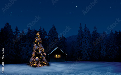 Leuchtender Weihnachtsbaum mit einer Belueuchtetend Hütte in einer Winternach...