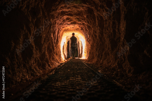 Light painting in the Historic rail tunnel, a part of an old gold mine transportation system located in Collins Drive Circuit, New Zealand photo