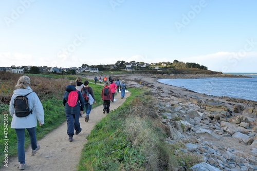 Group of senior hikers on a path in Brittany France